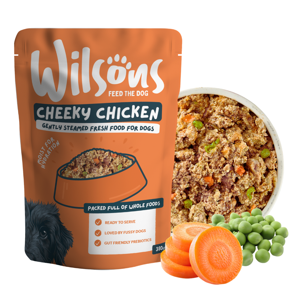 Wilsons Cheeky Chicken fresh pouch beside a bowl of the food with carrots and peas